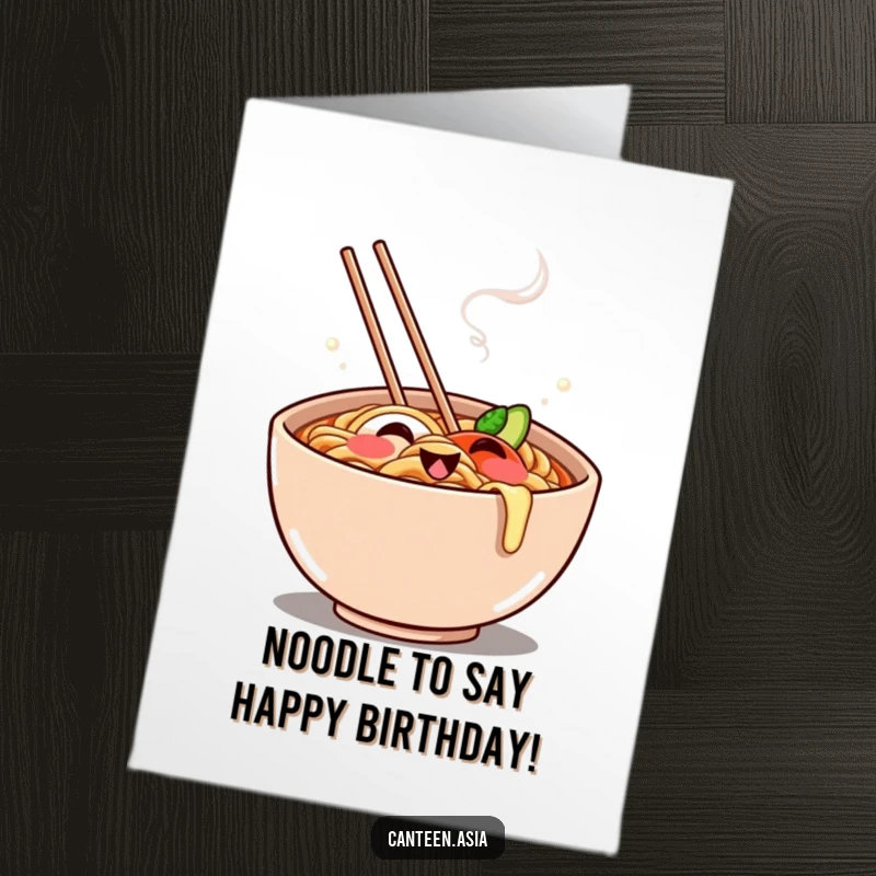 Funny Free Printable Birthday Card: A cheerful ramen bowl with steam forming a playful grin, wishing happy birthday.