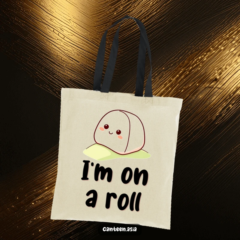 Funny onigiri tote bag featuring a smiling onigiri with a happy face rolling down a gentle slope.